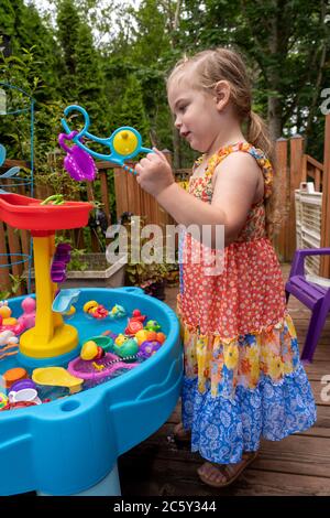 Child playing toy fishing rod hi-res stock photography and images - Alamy