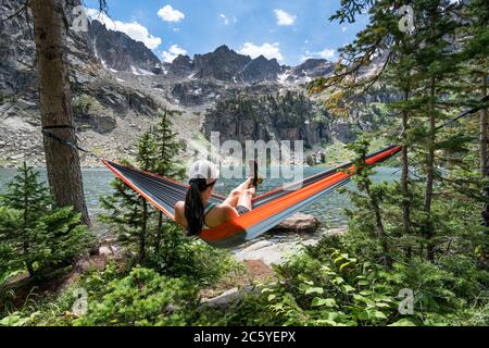 Relaxing in a hammock at Crater Lake, Granby Colorado USA Stock Photo