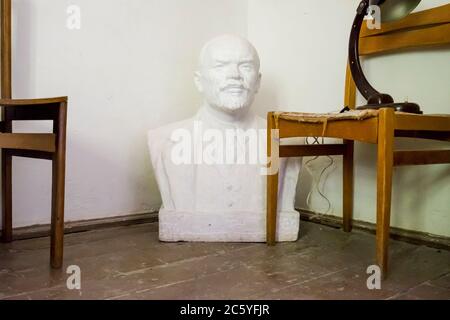 A bust of Lenin in a former prison building used by the German Nazis during WWII as a concentration camp headquarters. In Macikai, Lithuania. Stock Photo