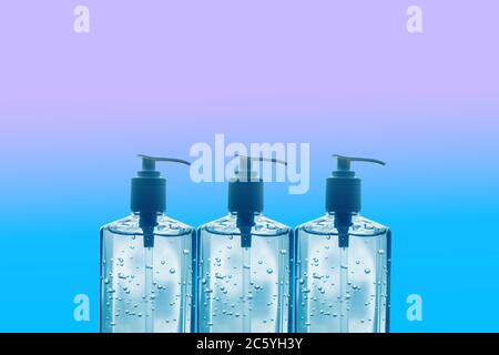 COVID-19 Icon many hand sanitizer bottles texture background. Hoarding of supplies shortage stockpile during coronavirus pandemic Stock Photo