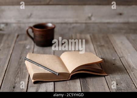 Office desk with blank screen smartphone,pen,notebook and coffee cup on wood table.Top view with copy space.Office supplies and gadgets on desk table.Working desk table concept.Flat lay image. Stock Photo