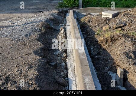 installation of kerb stone and making pavement Stock Photo