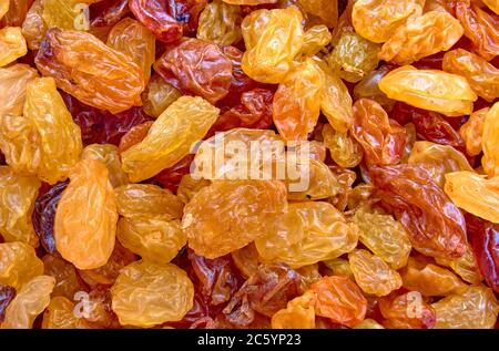scattered raisins as a background on the surface Stock Photo