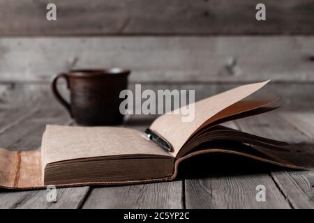 Office desk with blank screen smartphone,pen,notebook and coffee cup on wood table.Top view with copy space.Office supplies and gadgets on desk table.Working desk table concept.Flat lay image. Stock Photo