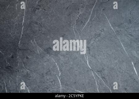 Gray scratched stone texture on background. Texture wallpaper Stock Photo