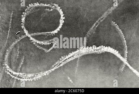 The condensation trails from German and British fighter planes engaged in an aerial battle appear in the sky over Kent, along the southeastern coast o Stock Photo