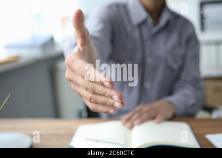Close up of male hand for a handshake in the office Stock Photo