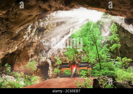 Ancient pavilion inside the hidden cave, sunbeam shines through large hole down on the pavilion. Phraya Nakhon Cave. Prachuap Khiri Khan, Thailand. Stock Photo