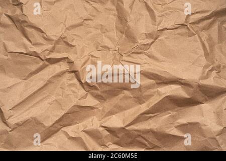 Abstract recycled brown crumpled paper background texture for design with copy space. Stock Photo