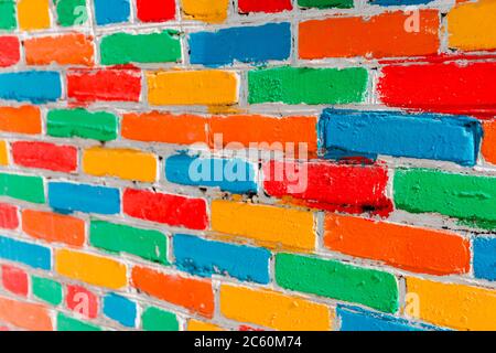 bright colorful multi-colored painted brick texture background, selective focus. Stock Photo