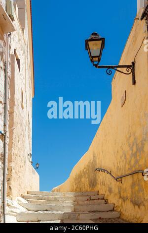 Traditional alley in Ano Syra, the catholic district of Syros island, in Cyclades complex, Greece, Europe. Stock Photo