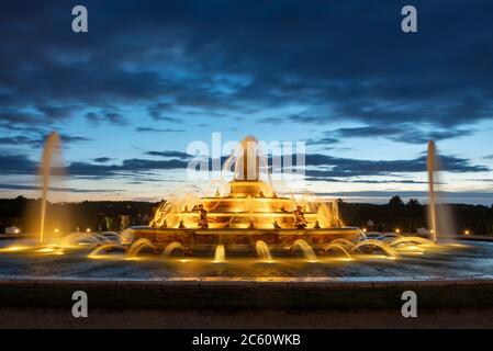 Latona fountain at twilight in the gardens of Versailles palace near Paris France Stock Photo