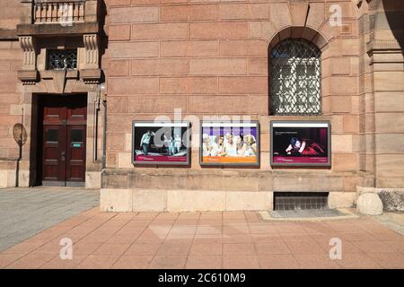 NUREMBERG, GERMANY - MAY 7, 2018: Poster promoting theater play in Staatstheater Nurnberg (State Theater of Nuremberg) in Germany. The theater opened Stock Photo