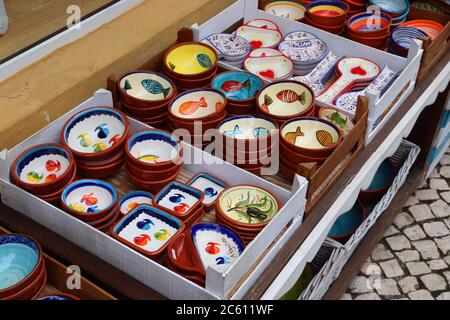 Traditional Portuguese pottery - typical handicraft souvenirs in Albufeira, Portugal. Stock Photo