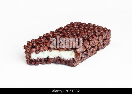 Delicious protein bar with milk filling isolated on white background. Chocolate energy cake Stock Photo
