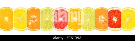 Sliced citrus fruits divided vertical lines isolated on white background. Stock Photo