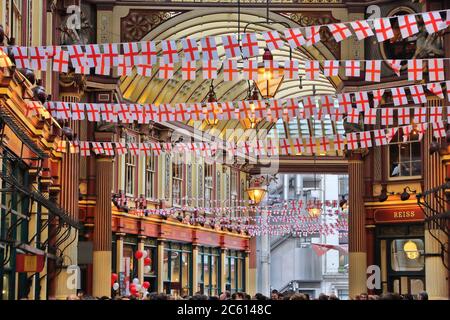 LONDON, UK - APRIL 22, 2016: Saint George's Day decorations in Leadenhall Market, London. Saint George is the patron saint of England. Stock Photo