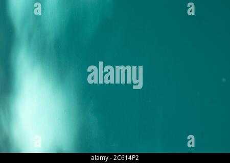 Blue textured wall background with shadow. Copy space Stock Photo