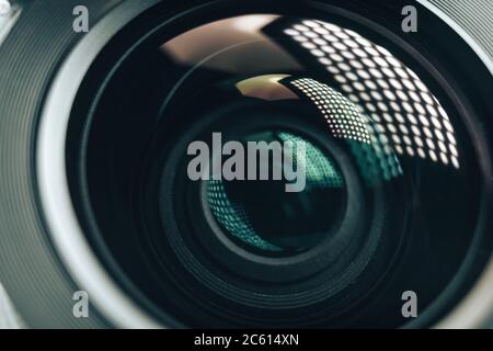 Close up beautiful camera aperture lens with multi colored light glass reflection. Macro view. Stock Photo