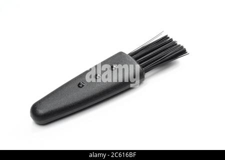 Black plastic brush isolated on white background. Tiny cleaning tool Stock Photo