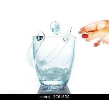 Ice for cocktail in a glass bucket isolated on white, summer concept, cooling drinks Stock Photo