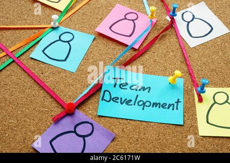 Team development sign on the board with pins and strings. Stock Photo