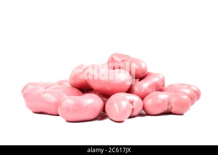 Peanut flips covered in pink strawberry flavor chocolate. Group of Tasty sweets isolated on white background Stock Photo