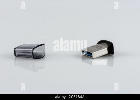 16GB memory stick USB 3.0 with opened cap on light background Stock Photo