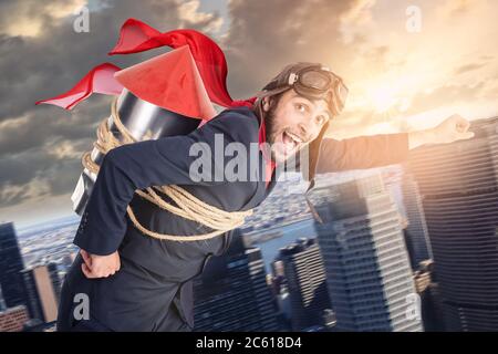 Businessman with homemade rocket and googles ready for a challenge Stock Photo