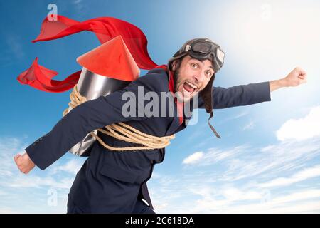 Businessman with homemade rocket and googles ready for a challenge Stock Photo