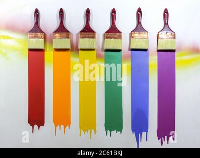 Paint brushes with multi-colored samples of paints. Stock Photo