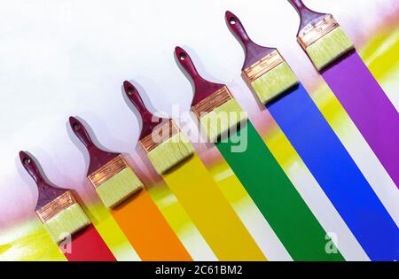 Paint brushes with multi-colored samples of paints. Stock Photo