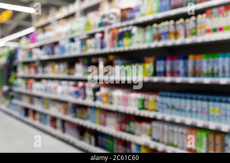 MINSK, BELARUS - April 01, 2020: Blurred background of hardware store with cleaning products, including cleaning products Stock Photo