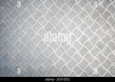 Industrial Background. Metal Diamond Plate Known As Chakkered or Tread Plate. Metallic Pattern. Stock Photo