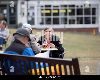 Westerham,Kent,UK,6th July 2020,As coffee shops and pubs are allowed to open after Lockdown since 23rd March 2020 people gathered to enjoy the sunshine on Westerham Green in Kent. The weather forecast is 19C and partly cloudy and for the rest of the week too.Credit: Keith Larby/Alamy Live News Stock Photo