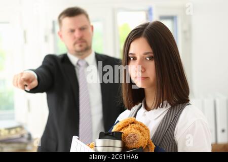Female office worker getting fired from job Stock Photo