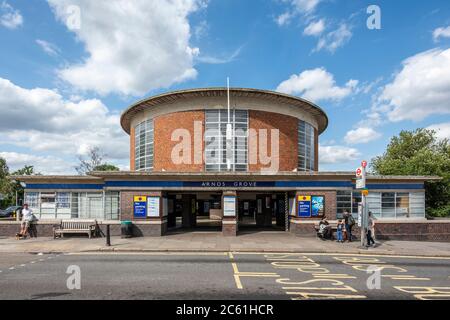 View of main elevation showing circular drum. Arnos Grove Underground Station, London, United Kingdom. Architect: Charles Holden, 1932. Stock Photo