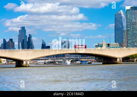 Red double decker bus on the Waterloo Bridge over the Thames river, London, UK Stock Photo