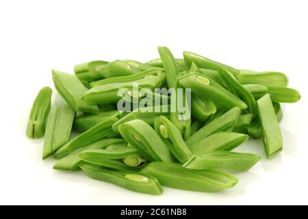 bunch of cut string beans on a white background Stock Photo