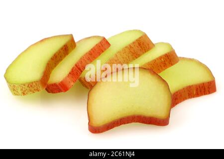 freshly  cut pieces of rhubarb on a white background Stock Photo