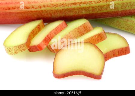 freshly  cut pieces of rhubarb on a white background Stock Photo