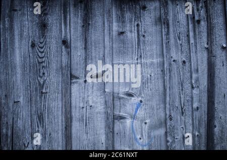 Vintage wooden background with faded peeling white paint. Old wooden painted texture surface. Shabby Planks with cracked color paint. Stock Photo