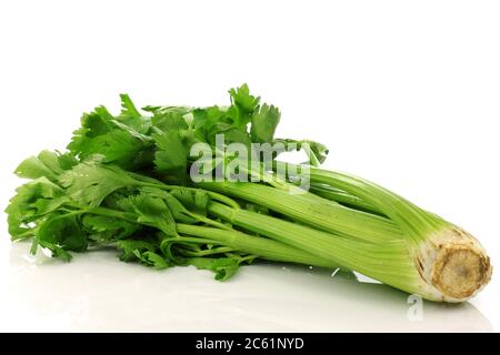 fresh celery stems on a white background Stock Photo