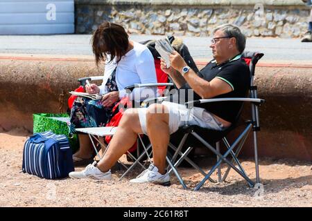 Goodrington Sands, Paignton, Devon, UK.  6th July 2020.   UK Weather:  Holidaymakers on the beach at Goodrington Sands at Paignton in Devon on a day of warm sunny spells.  Picture Credit: Graham Hunt/Alamy Live News Stock Photo