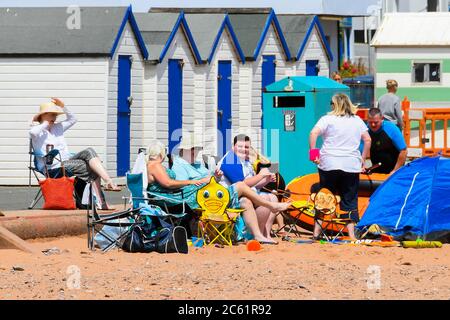 Goodrington Sands, Paignton, Devon, UK.  6th July 2020.   UK Weather:  Holidaymakers on the beach at Goodrington Sands at Paignton in Devon on a day of warm sunny spells.  Picture Credit: Graham Hunt/Alamy Live News Stock Photo