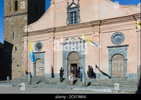 Villagers leave San Donato Church after a wedding in the main square of Civita di Bagnoregio in Italy Stock Photo