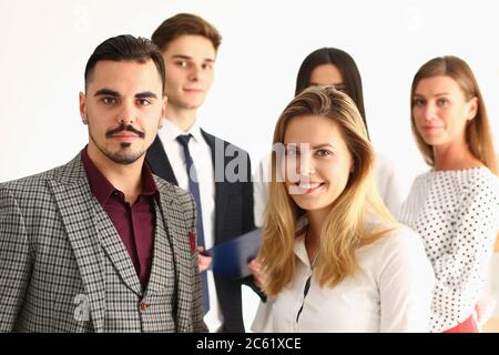 Successful happy workers are posing at camera Stock Photo