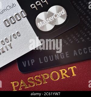 RUSSIA, MOSCOW - FEB 22, 2015: Premium credit card MasterCard Black Edition, Priority Pass card (card for VIP lounge access) and international passpor Stock Photo