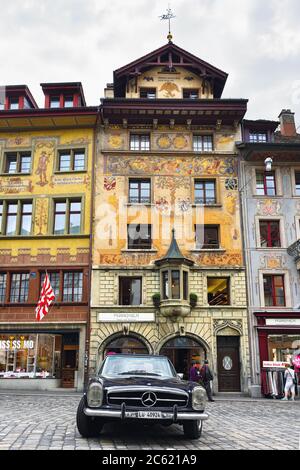 LUCERNE, SWITZERLAND - JUNE 14, 2017: Vintage oldtimer Mercedes Benz 250 SL Convertible car parked on the picturesque Weinmarkt square in Luzerne Stock Photo