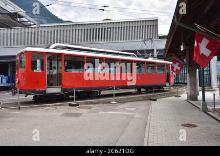 Vitznau, Switzerland - June 14, 2017: The passenger tourist red train at the station before going the top Rigi Kulm mountain Stock Photo